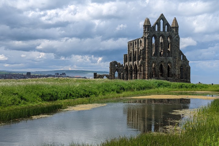 a castle surrounded by a body of water
