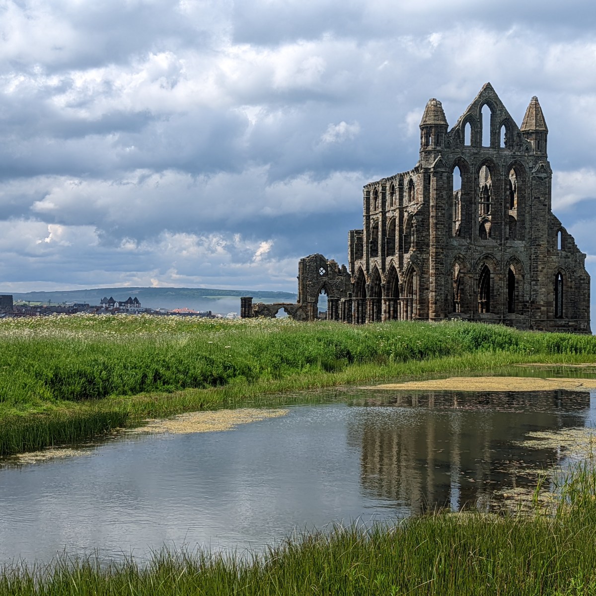 a castle surrounded by a body of water