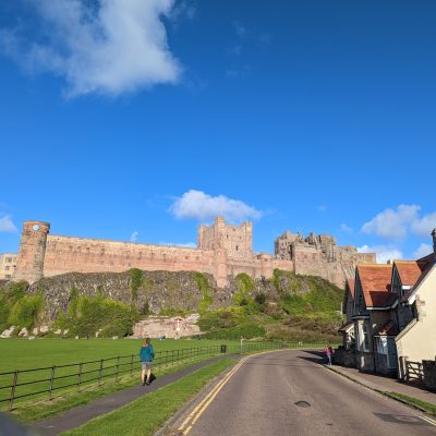 a castle sitting on the side of a road