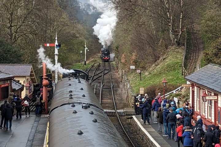 a group of people on a train track
