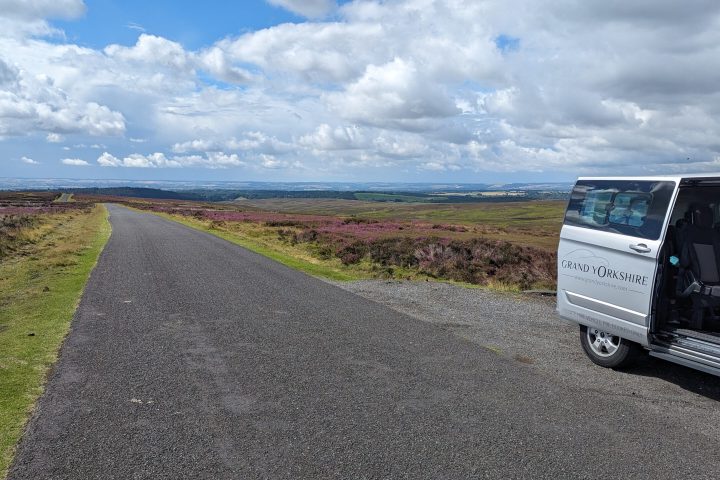 a truck driving down a dirt road
