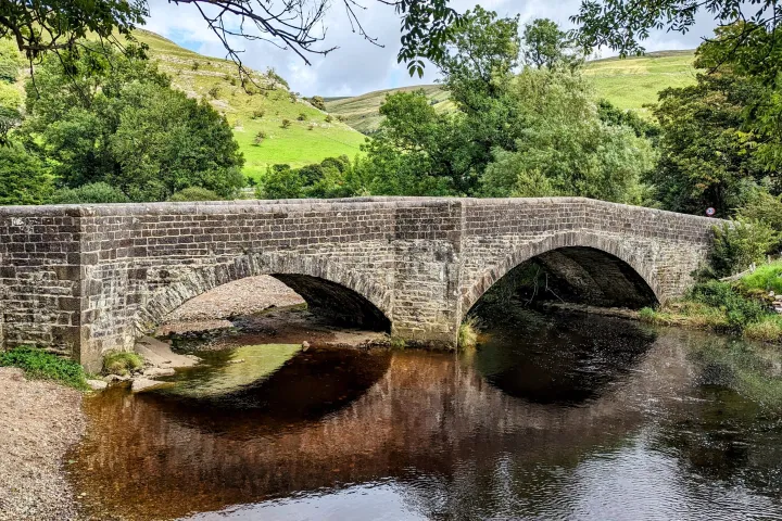 a stone bridge over a body of water